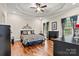 Spacious main bedroom with a decorative ceiling, dark wood floors and a fireplace at 1616 Indian Springs Nw Dr, Conover, NC 28613