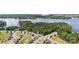 An aerial shot of a residential neighborhood next to a lake and surrounded by lush greenery at 17637 Snug Harbor Rd, Charlotte, NC 28278