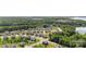 An aerial view captures a dense residential community near a lake at 17637 Snug Harbor Rd, Charlotte, NC 28278