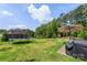 A spacious backyard with a trampoline, patio furniture, and green lawn invites outdoor enjoyment at 17637 Snug Harbor Rd, Charlotte, NC 28278