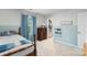 Cozy bedroom with half blue walls, a window with curtains, closet, and a plush carpet at 17637 Snug Harbor Rd, Charlotte, NC 28278
