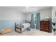 Charming bedroom featuring a half blue wall, window with blue curtains, and hardwood furniture at 17637 Snug Harbor Rd, Charlotte, NC 28278