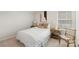 Serene bedroom with white bedding, cozy chair, and two matching bedside tables, perfect for relaxation at 17637 Snug Harbor Rd, Charlotte, NC 28278