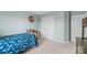 Bright bedroom with light blue walls, plush carpet, and a large closet for ample storage at 17637 Snug Harbor Rd, Charlotte, NC 28278