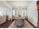Elegant dining room with a chandelier, large table, and a view into the living room at 17637 Snug Harbor Rd, Charlotte, NC 28278