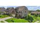Lovely two-story home with a well-kept lawn, a brick facade, and an attached garage at 17637 Snug Harbor Rd, Charlotte, NC 28278