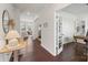Welcoming foyer with hardwood floors, archway, and open view to the living room and office at 17637 Snug Harbor Rd, Charlotte, NC 28278