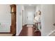 Bright foyer featuring hardwood floors, a decorative table, and a front door with glass panes at 17637 Snug Harbor Rd, Charlotte, NC 28278