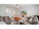 Bright living room with two sofas, TV, fan, carpet, and neutral decor, ideal for Gathering gatherings at 17637 Snug Harbor Rd, Charlotte, NC 28278