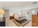 Spacious main bedroom with neutral carpet, a large bed with bedside tables and a decorative area rug at 17637 Snug Harbor Rd, Charlotte, NC 28278