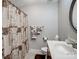 Nicely appointed bathroom featuring a shower with curtain, built in shelving, and decorative towels at 1836 Fairlawn Ct, Rock Hill, SC 29732
