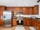 Kitchen with stainless steel appliances, and wood cabinets; offering storage and efficient meal preparation at 1836 Fairlawn Ct, Rock Hill, SC 29732