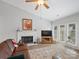 Bright living room features a fireplace, neutral walls, and access to outdoor patio with lots of sunlight at 1836 Fairlawn Ct, Rock Hill, SC 29732