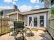Enclosed patio with chairs and table featuring direct access to the home through elegant glass doors at 1836 Fairlawn Ct, Rock Hill, SC 29732