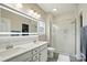 Modern bathroom featuring a double sink vanity, stylish mirror, and glass shower at 18619 Mainsail Ct, Lancaster, SC 29720