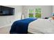 Relaxing bedroom featuring natural light, soft carpet, and a mounted TV at 18619 Mainsail Ct, Lancaster, SC 29720