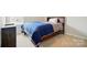 Cozy bedroom featuring soft carpet, natural light, and a dark wood bed frame at 18619 Mainsail Ct, Lancaster, SC 29720
