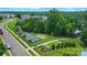 Aerial shot of community amenities including a bocce ball court, putting green, and grilling area, nestled in lush greenery at 18619 Mainsail Ct, Lancaster, SC 29720