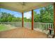 Covered deck offering an outdoor living space with a scenic view at 18619 Mainsail Ct, Lancaster, SC 29720