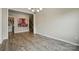 Versatile entry room with modern artwork and access to laundry facilities and stairs at 18619 Mainsail Ct, Lancaster, SC 29720