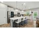Beautiful kitchen boasts a center island with bar seating, stainless appliances, and white cabinets at 18619 Mainsail Ct, Lancaster, SC 29720