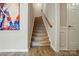 Clean stairway featuring modern design, and a mix of carpeted and hard flooring at 18619 Mainsail Ct, Lancaster, SC 29720