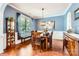 Elegant dining room with wainscoting, stylish lighting, and ample space for Gathering gatherings at 18732 Coachmans Trce, Cornelius, NC 28031