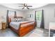 Primary bedroom with a ceiling fan and a large bed with decorative pillows at 2116 Eastway Dr, Charlotte, NC 28205