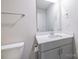 Contemporary bathroom boasts a white countertop sink, modern fixtures, and toilet at 2116 Morgan Hills Dr, Albemarle, NC 28001