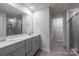 Modern bathroom boasts double sink vanity with shower and tile floors at 2116 Morgan Hills Dr, Albemarle, NC 28001