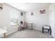 This carpeted room is staged as an office with neutral colored walls and modern decor at 2116 Morgan Hills Dr, Albemarle, NC 28001