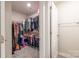 Walk-in closet with plentiful shelving and hanging space for organized storage at 2116 Morgan Hills Dr, Albemarle, NC 28001