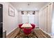 Stylish dining room featuring a marble table, eye-catching red chairs, and elegant decor at 2116 Morgan Hills Dr, Albemarle, NC 28001