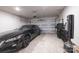 Spacious garage featuring a black car, storage shelves, and plenty of room at 2116 Morgan Hills Dr, Albemarle, NC 28001