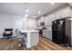 Contemporary kitchen with stainless steel appliances, light gray cabinets, and a stylish island at 2116 Morgan Hills Dr, Albemarle, NC 28001