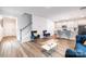 Bright living room featuring an open floor plan, hardwood floors, and modern furnishings at 2116 Morgan Hills Dr, Albemarle, NC 28001
