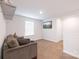 The living room has neutral colored walls and carpet and a wall-mounted TV at 2116 Morgan Hills Dr, Albemarle, NC 28001