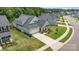 Aerial view of single-Gathering home with a two-car garage, manicured lawn, and welcoming front porch at 218 Tetcott St, Mooresville, NC 28115