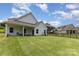 Spacious backyard with a black fence surrounding the property, offering privacy and security at 218 Tetcott St, Mooresville, NC 28115