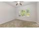 Bedroom features carpet and large windows at 218 Tetcott St, Mooresville, NC 28115