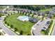 Aerial view of a community pool with ample parking and green spaces in a residential neighborhood at 218 Tetcott St, Mooresville, NC 28115