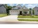 Charming single-Gathering home featuring a two-car garage, manicured lawn, and welcoming front porch at 218 Tetcott St, Mooresville, NC 28115