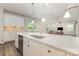 Bright, open kitchen with a large island, stainless steel appliances, and modern pendant lighting at 218 Tetcott St, Mooresville, NC 28115