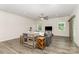 Spacious living room with hardwood floors, bright windows, and a ceiling fan at 218 Tetcott St, Mooresville, NC 28115