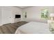 Bright main bedroom featuring a tv, natural light, and ensuite bath at 218 Tetcott St, Mooresville, NC 28115