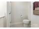 Neutral powder room offers toilet, towel rack, and modern fixtures at 218 Tetcott St, Mooresville, NC 28115