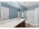 Bathroom featuring single sink, a large mirror, and a shower/tub combo with a white curtain at 237 River Clay Rd, Fort Mill, SC 29708