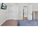 Bedroom with a sliding door closet and a door to another room at 237 River Clay Rd, Fort Mill, SC 29708