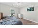 Bedroom with a window, dresser, and mounted TV at 237 River Clay Rd, Fort Mill, SC 29708