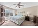 Cozy bedroom with a ceiling fan, large window providing natural light, and carpeted floors at 237 River Clay Rd, Fort Mill, SC 29708